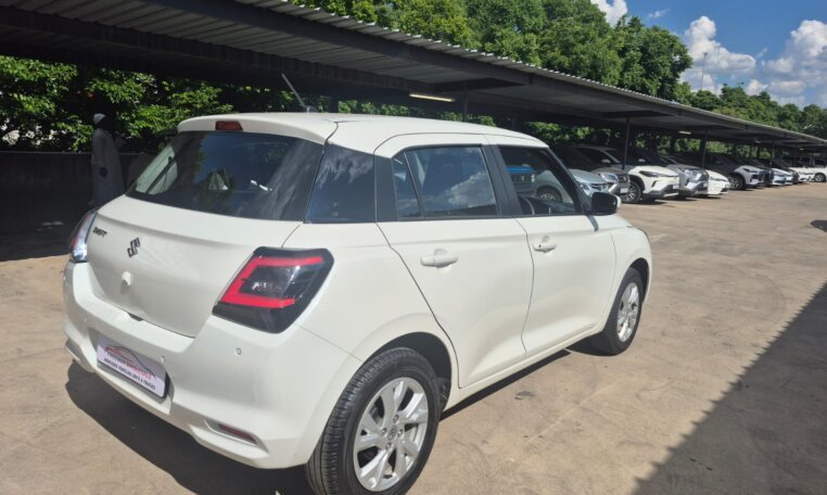 White 2025 Suzuki Swift, rear three-quarter view