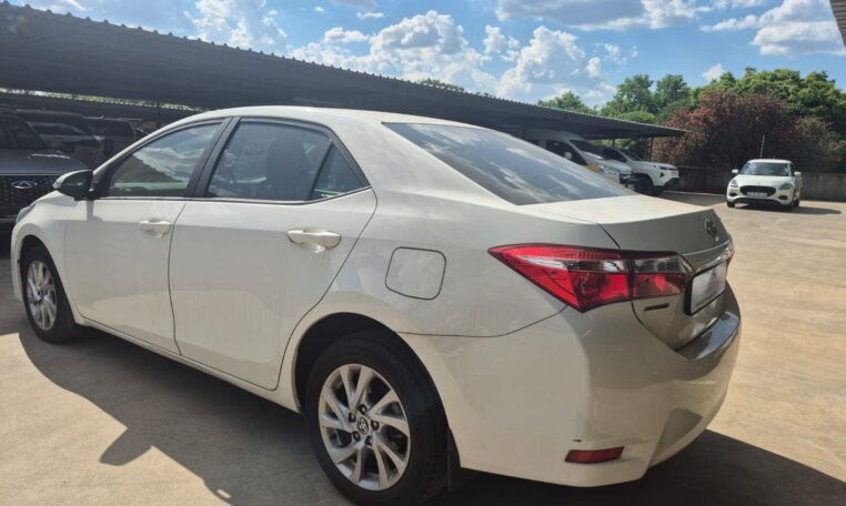 White 2025 Toyota Corolla Quest Exclusive, rear three-quarter view