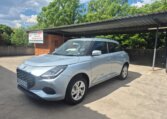 Silver 2025 Suzuki Swift, opposite front three-quarter view