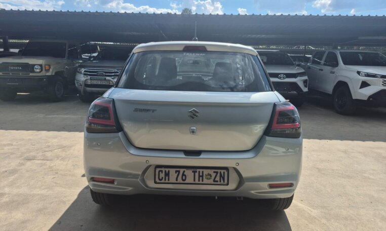 Silver 2025 Suzuki Swift, rear view