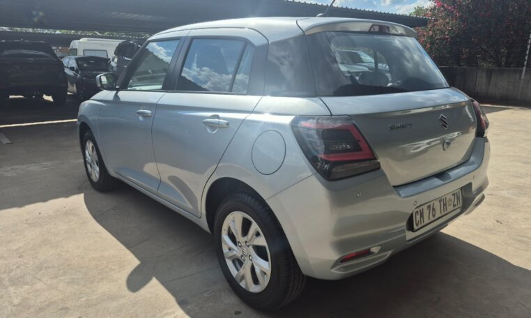 Silver 2025 Suzuki Swift, rear three-quarter view
